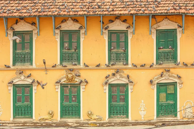 Traditional Newari house with carved wooden windows near Boudhanath